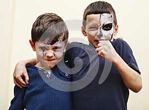 zombie apocalypse kids concept. Birthday party celebration facepaint on children scar face, skeleton together having fun