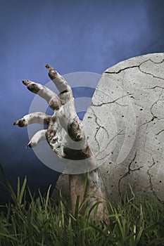 Zombie hand coming out of the ground