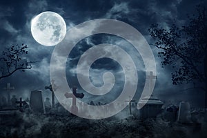 Zombie Rising Out Of A Graveyard cemetery In Spooky dark Night photo