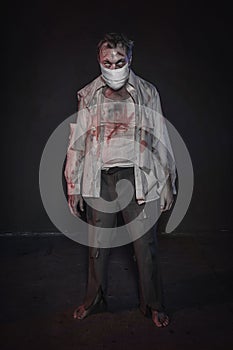 Zombie wearing medical mask. Coronavirus, pandemic and Apocalypse concept