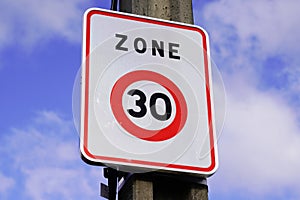 Zone 30 french city road car sign to limit town center vehicle speed to 30km per hour