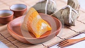 Zongzi - Alkaline rice dumpling - Traditional sweet Chinese crystal food on a plate to eat for Dragon Boat Duanwu Festival