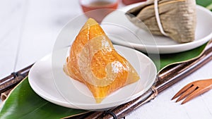 Zongzi - Alkaline rice dumpling - Traditional sweet Chinese crystal food on a plate to eat for Dragon Boat Duanwu Festival