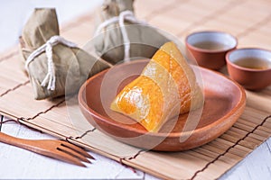 Zongzi - Alkaline rice dumpling - Traditional sweet Chinese crystal food on a plate to eat for Dragon Boat Duanwu Festival