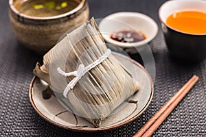 Zongzi or Asian Chinese sticky rice dumplings with Yellow tea, s