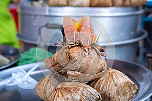 Zongzi or Ba Jang, product samples placed in stainless steel plates for customers to see