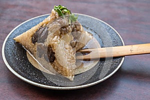 Zongzi, rice dumpling on wooden table in Tainan, Taiwan