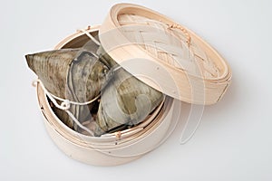 Zongzi in round bamboo crate