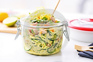 zoodles in a glass meal prep container