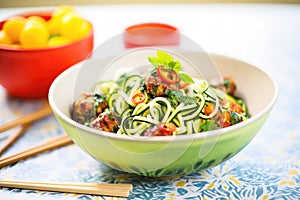 zoodles with meatballs in a bright bowl