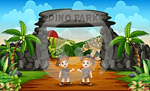 Zookeeper boy and girl on the dino park entrance