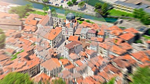 Zoom blurred top view of the old town in Kotor focused on a church. Montenegro