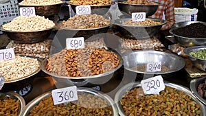 zoom in on dried fruit and nuts at the spice market in old delhi, india
