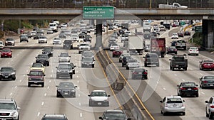 Zoom Out / Overhead View of Traffic on Busy Freeway in Downtown Los Angeles California