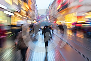 Zoom picture of people at dawn on the move in the city