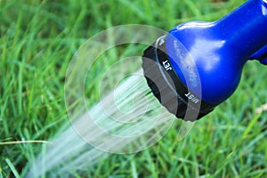 Zoomed close to The sprinkler head is working.