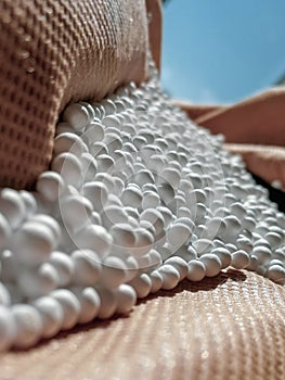 Zoomed white expanded polystyrene pellets photo