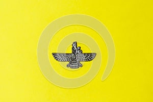 Zoroastrian symbol on yellow background