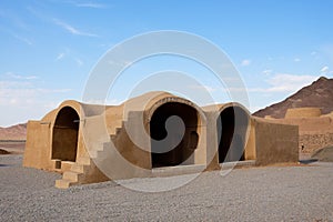 Zoroastrian Towers of Silence desert landscape in Yazd, Iran. A Dakhma, an ancient mud-brick house and an archeological treasure