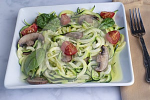 zucchin noodles with mushrooms, tomatoes and spinach