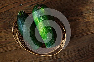 Zucchini in a basket on table