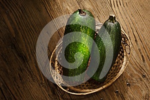 Zucchini in a basket on table