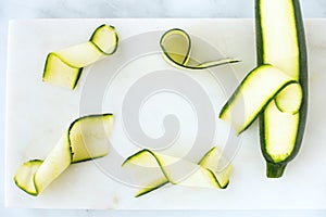 Zucchini, Courgette Ribbons and Zucchini, Courgette on Marble Board