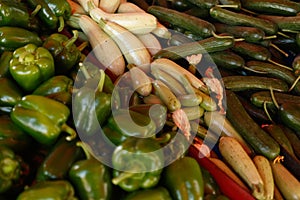 Zucchini, cucumbers and peppers on a shopping arcade.