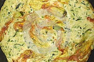 Zucchini flowers omelette close up