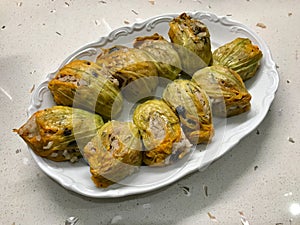 Zucchini Flowers Stuffed with Rice Pilaf for Dolma / Turkish Food Served with Plate