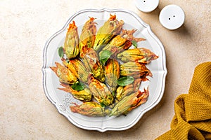 Zucchini Flowers stuffed with ricotta cheese, egg and bread crumbs, parsley.