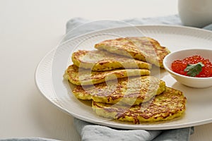 Zucchini pancakes with potato and red caviar, fodmap keto diet side view closeup