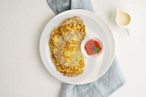 Zucchini pancakes with potato and red caviar, fodmap keto diet top view