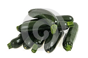 Zucchini piled up close-up on white background photo
