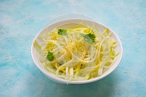 Zucchini raw vegan pasta on plate. Vegetarian healthy food