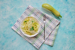 Zucchini raw vegan pasta with on plate. Vegetarian healthy food