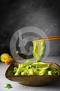 Zucchini ribbon salad with parsley, dill and garlic in marinade