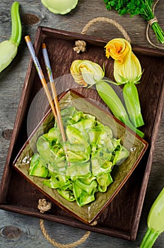 Zucchini ribbon salad with parsley, dill and garlic in marinade