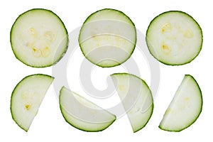 Zucchini slices isolated on white background, top view. Green fresh zucchini slices on white background. Slices of