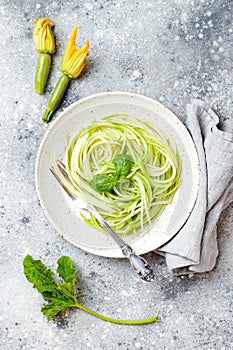 Zucchini spaghetti with basil. Vegetarian vegetable low carb pasta. Zucchini noodles or zoodles