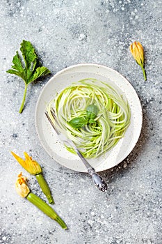 Zucchini spaghetti with basil. Vegetarian vegetable low carb pasta. Zucchini noodles or zoodles