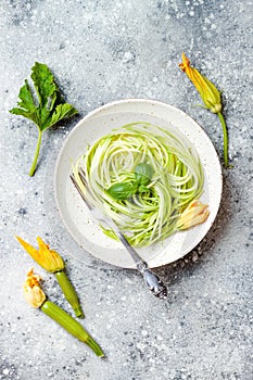 Zucchini spaghetti with basil. Vegetarian vegetable low carb pasta. Zucchini noodles or zoodles