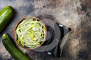 Zucchini spaghetti or noodles zoodles bowl. Top view, copy space.