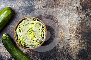 Zucchini spaghetti or noodles zoodles bowl. Top view, copy space.