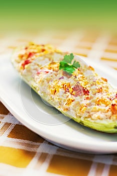 Zucchini stuffed with cheese, onions, garlic and tomatoes