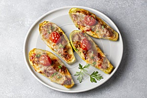 Zucchini stuffed with meat, vegetables and cheese. Zucchini boats. Turkish name kabak sandal