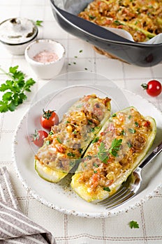 Zucchini stuffed with minced meat and tomatoes and cheese