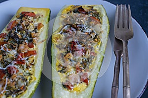 Zucchini stuffed with shrimps, vegetables and cheese. Baked zucchini boats