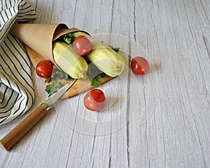 zucchini, tomatoes, parsley on a wooden background
