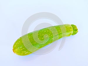 Single zucchini vegetable courgette baby marrow hybrid summer squash an edible vining herbaceous plant food closeup image photo photo